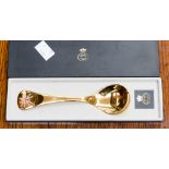 A Georg Jensen silver gilt presentation spoon, enamelled pink flower to the handle,