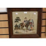 A framed and glazed tapestry, man leading child and a pony, dating approx 1850,