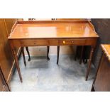A 19th Century mahogany writing table, gallery back, having two short drawers,