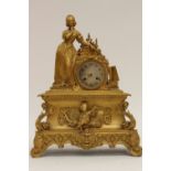 A 19th Century French Ormolu mantle clock, with key and pendulum,