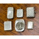 A collection of silver vesta cases, one with diagonally reeded decoration, E V Pledge and Son,