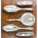 A George V five piece dressing table brush/mirror set, all pieces hallmarked Sheffield 1911,