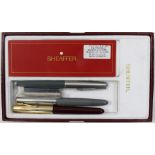 A Sheaffer box containing a collection of pens, including Hadfields, two further fountain pens,