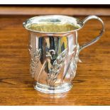 A late Victorian silver mug, embossed with wheat motifs, inscribed Harvey Pager, July 25th 1942,