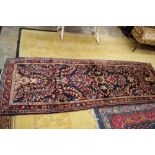 Blue ground Persian runner with unique floral all over design