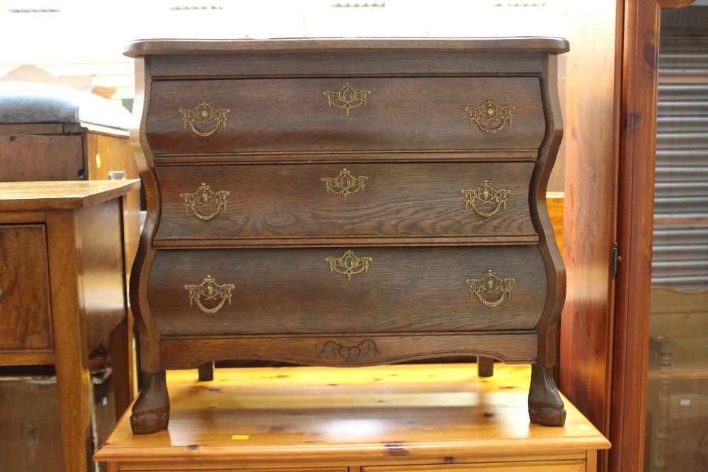 A Dutch style bombe oak chest of drawers,