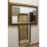 Three gilt framed mirrors