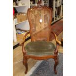 A Victorian style bergere backed armchair,