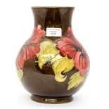A Moorcroft Flambe bulbous vase, Hibiscus pattern, initialled to base,