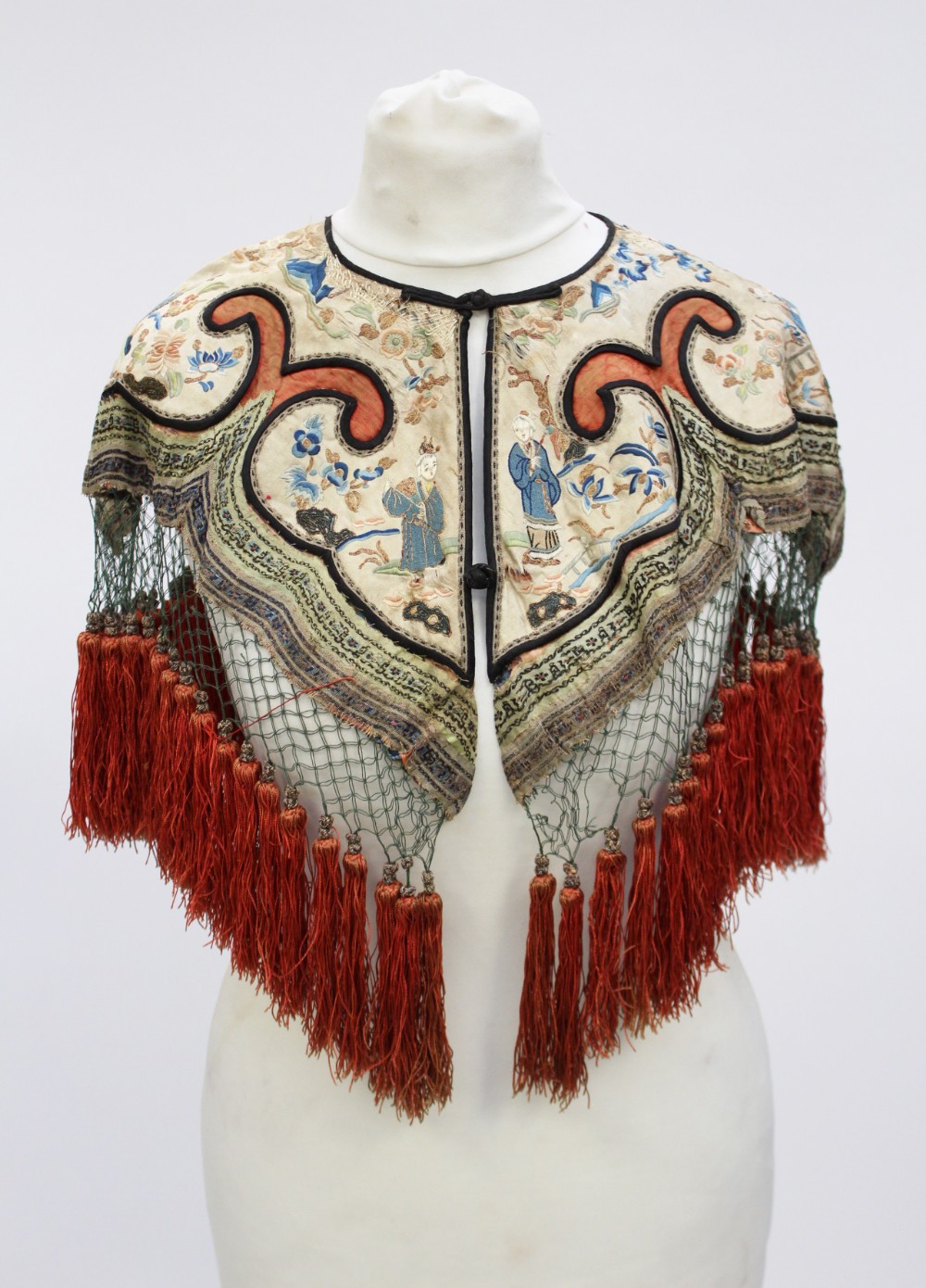 A deeply fringed silk hand embroidered Chinese cape,