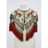 A deeply fringed silk hand embroidered Chinese cape,