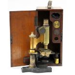 Ross London: A lacquered brass and black enamelled monocular microscope, signed `Ross, London,