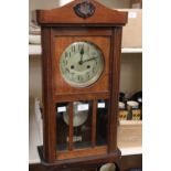 An early 20th Century mahogany wall clock,