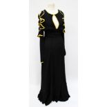 A good Ossie Clark 1972 evening dress in black crepe with bias cut frills of the cut out shoulders,