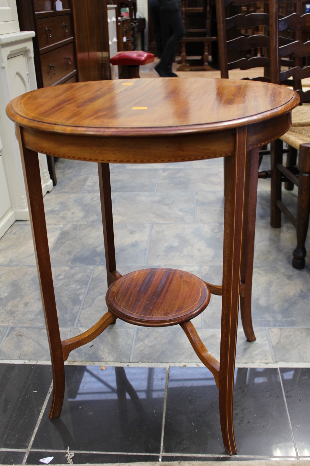 An Edwardian mahogany occasional table,