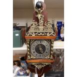 A modern wall fitting pendulum clock, in as new condition,