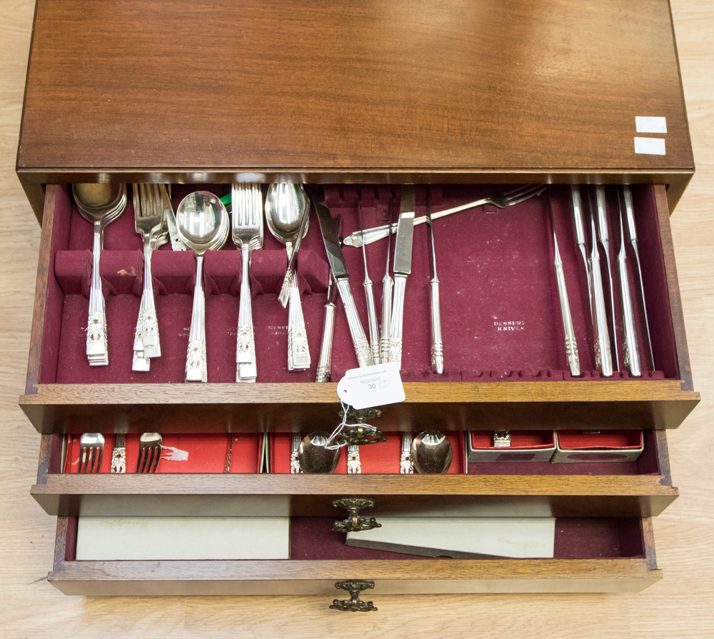 A walnut three drawer canteen of cutlery, community plate cutlery,