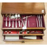 A walnut three drawer canteen of cutlery, community plate cutlery,