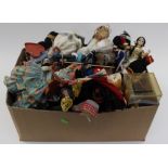 A box of dolls to include various dolls from around the world wearing the National Dress of their