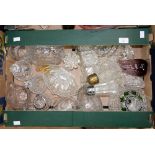 A box containing a collection of various glassware including cut glass dishes, bowls, vases,