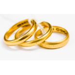 Three 22ct gold wedding bands of various ring sizes, comprising sizes N, L and J1/2,