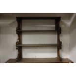 A 19th Century three tier wall hanging mahogany shelf unit, 82cm high, 83cm wide,