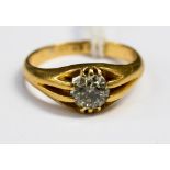 A diamond solitaire 18ct yellow gold ring, the tinted champagne diamond weighing approximately 0.