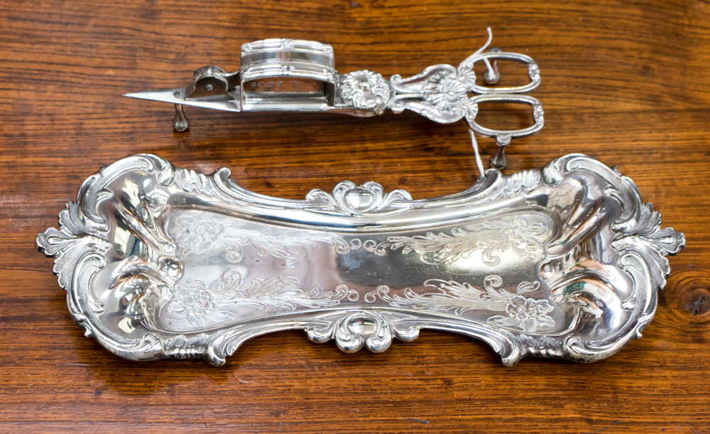 A silver plated snuffer and tray