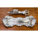 A silver plated snuffer and tray