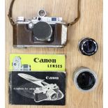 A Canon camera No 211647, leather cased with cased lenses,