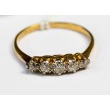 A diamond graduated five stone 18ct yellow gold and platinum set ring,