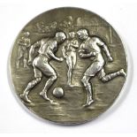 Football Medal: A silver 'Inter Platoon Football Competition' football medal embossed with a