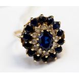 A blue and white stone 9ct yellow gold cluster ring, ring size O,