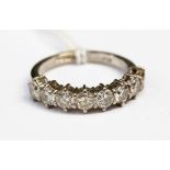 An eight stone diamond ring on 18ct white gold band, approx 1¾ carats total diamond weight,