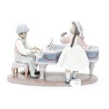 A Lladro figure group of 'A Jazz Duo' number 05930 contained within box.
