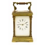 A 19th Century French brass carriage clock, white enamel dial, Roman numerals,