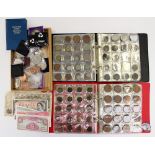 A box of British and International coins, including British Armed Forces £1 note,