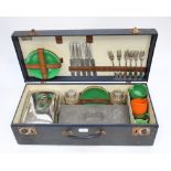 A 1950s picnic set in case