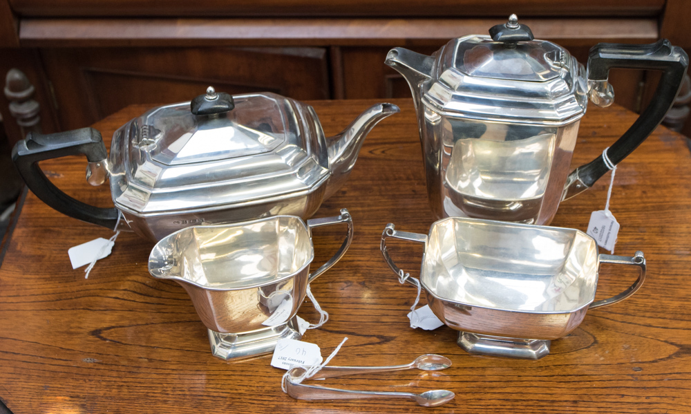 A four piece silver tea service comprising: teapot, hot water jug,