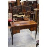 A 20th Century oak mirror backed dressing table,