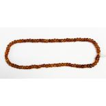 An amber bead necklace,