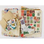 A school boy collection of stamps, stamp album and loose stamps,