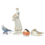 A Lladro figure of a lady with a basket and a Cockerel, a Canadian bird,