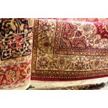 A pair of Beigee ground Keshan rugs, 190cm x 140cm.