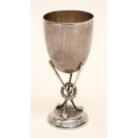Golf Memorabilia: A William Hutton silver golf trophy, the cup supported on three golf clubs,