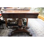 A 19th Century mahogany fold over games table, 73cm high, 90cm wide,