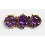 Amethyst three stone Victorian yellow gold brooch,