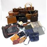 A quantity of vintage and modern handbags, to include 1950s Crocodile skin handbags, vintage YSL,