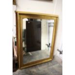 A large modern gilt framed mirror, 120cm high,