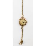 A ladies 9ct gold Rverite watch on a rolled gold bracelet